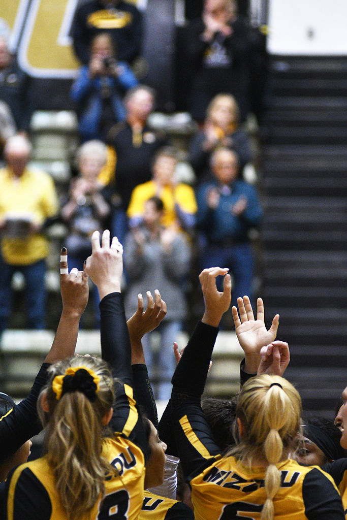 The Missouri volleyball team cheers before their match against Ole Miss